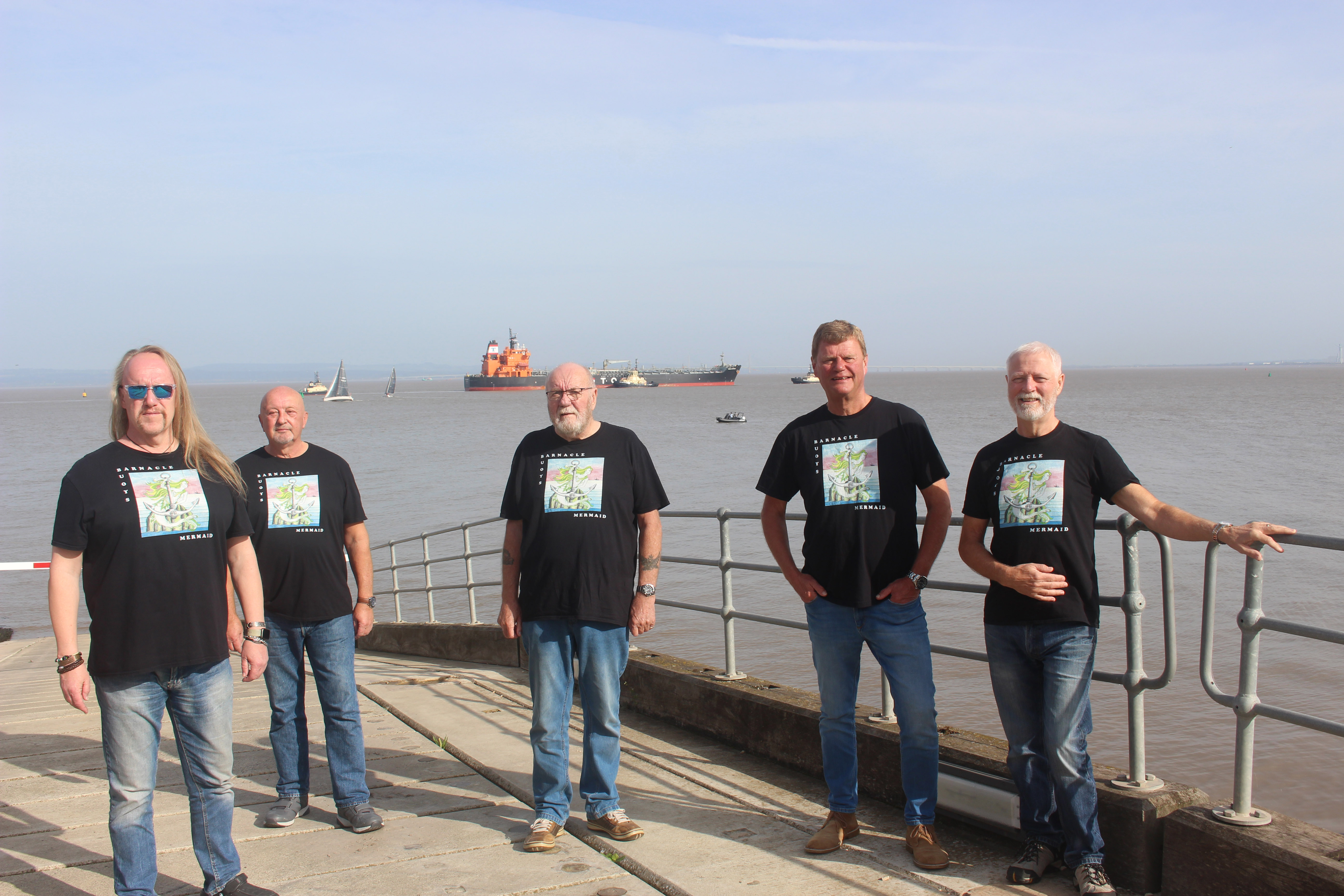 Men standing around on a harbour