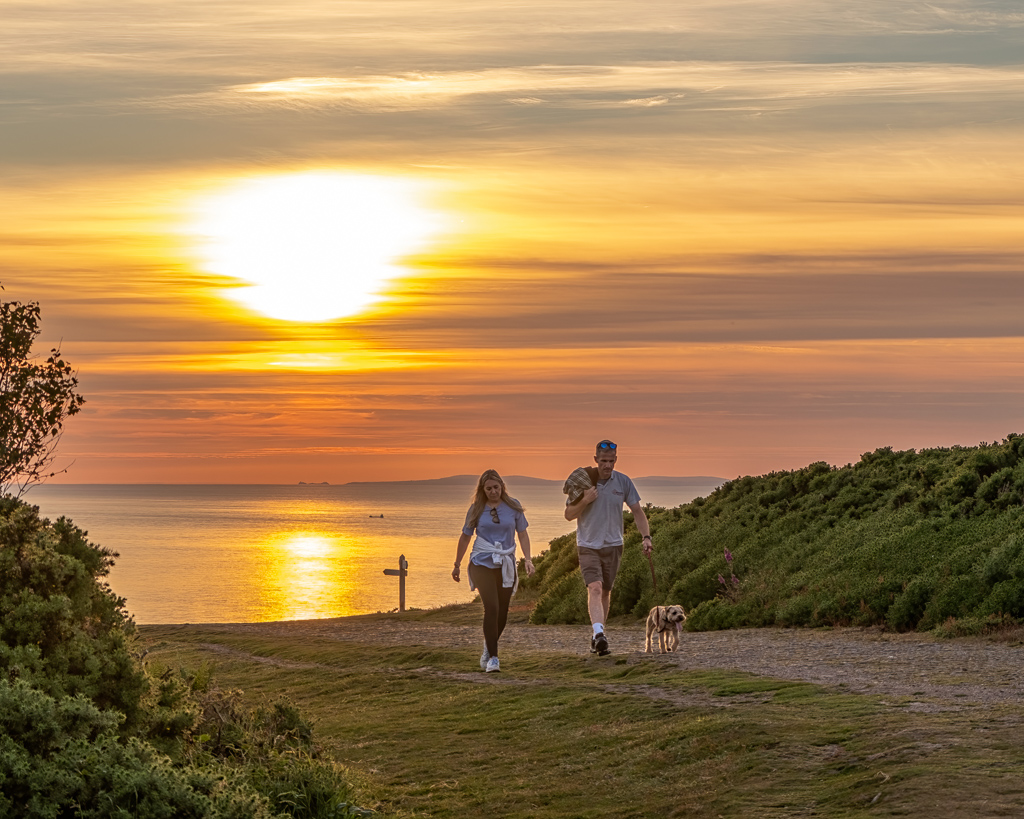 Walkers on Exmoor at sunset by Shaun Davey