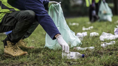 Photo of someone picking up rubbish